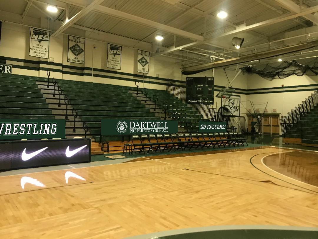This is a Photoshop rendering of a school gym decorated with graphics.