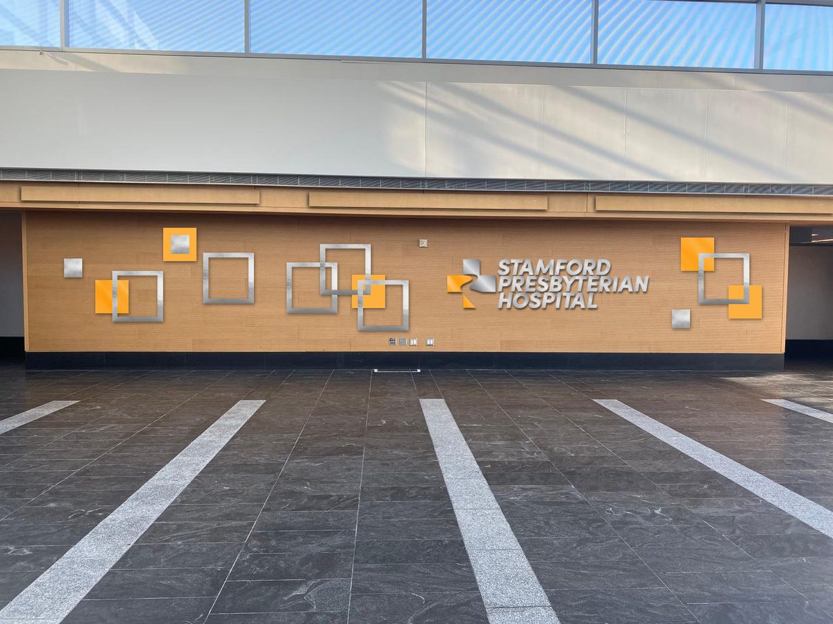 We had a massive room that was going to be turned into a waiting area with a coffee kiosk and rows of chairs. The production designer asked me to come up with a design solution that would clearly communicate this area was inside the hospital. I designed this dimensional signage and it was a hit with her, the director and the producers.