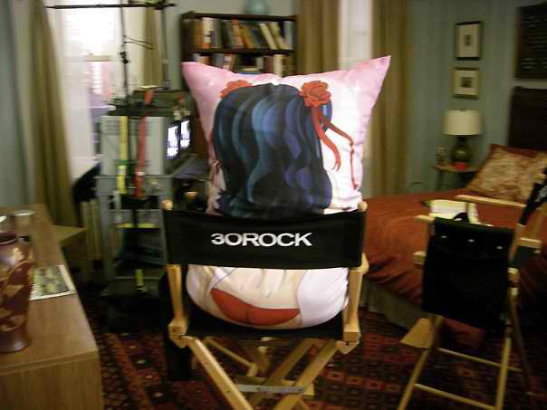 The apartment set dressed and lit, with the pillow in place.