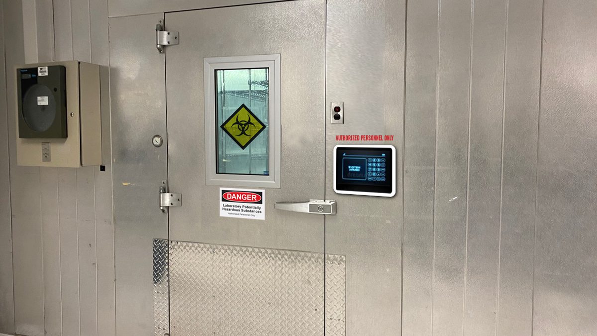 Biohazard and warning stickers on a refrigerator door add drama.