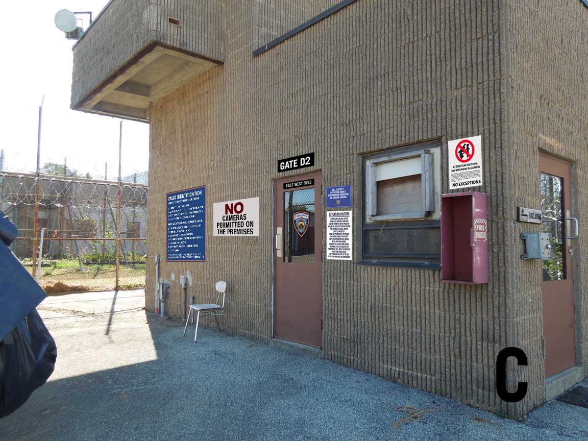 The guard house, carrying eight separate notices without looking arranged.