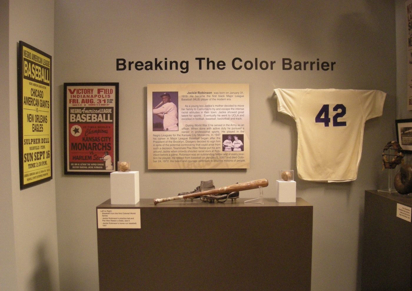 A number 42 jersey, a bat, a ball and the posters that put them in context.