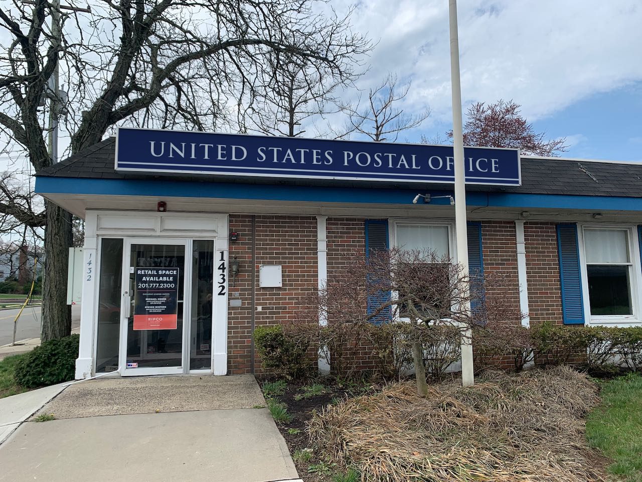 We turned an empty building into a Post Office with graphics. This is a photoshop composite of the main sign above the door that would help establish the location for the audience.
