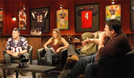 Framed and hung with the jerseys, doing exactly what set dressing should — going unnoticed.